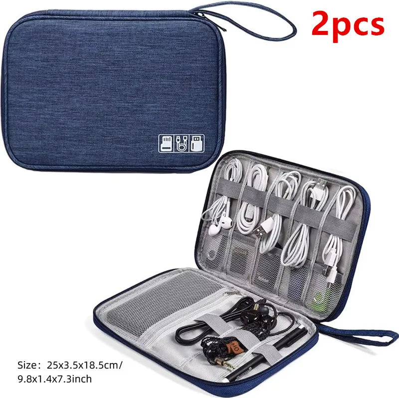 Two dark blue portable digital organizer storage pouches with included cables and accessories