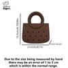 Brown round PVC handbag with a perforated design and a loop handle