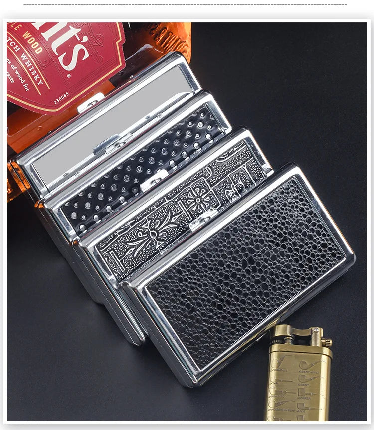 A silver metal cigarette case holder with textured surfaces is shown next to a box of tobacco.