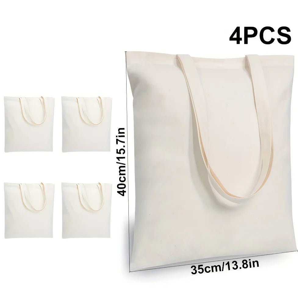 Quatre sacs en toile de coton blanc avec poignées beige clair, présentés verticalement.