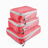 A set of three red and gray reusable compression packing cubes.