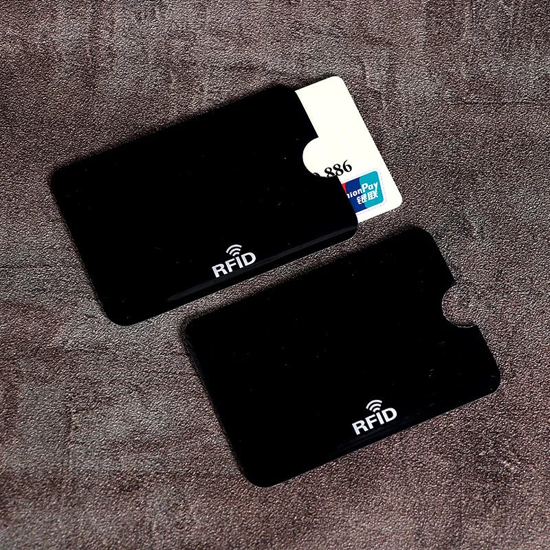 A black RFID protection card sleeve is shown next to a white credit card.