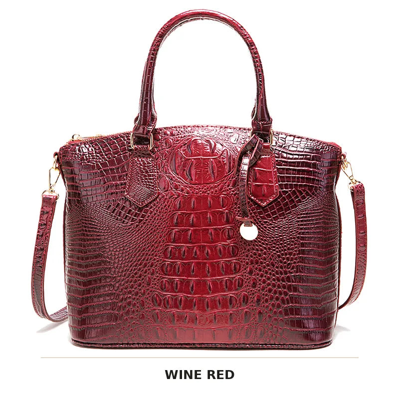 Weinrotes Krokodillenmuster-Top mit Henkel für eine Crossbody-Tasche.