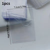 A clear acrylic photocard holder with a wing design is shown next to a purple plastic case.