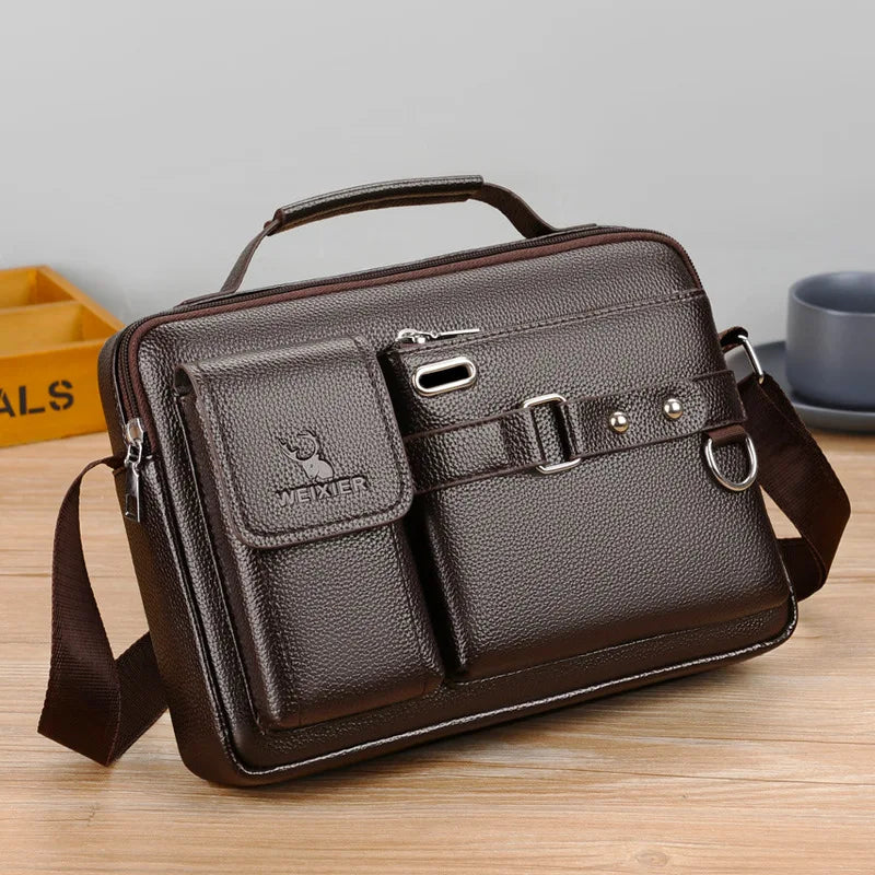 A dark brown men's PU leather crossbody shoulder bag with a flap and strap resting on a wooden surface.