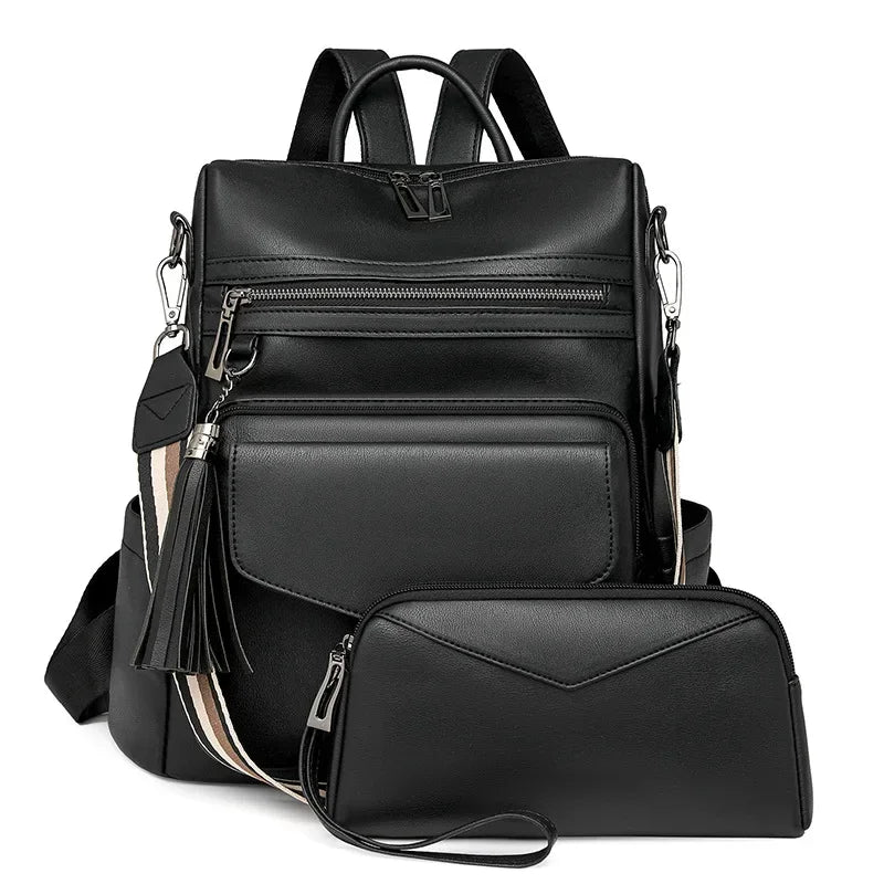 Black retro PU leather travel backpack featuring a tassel detail and multiple compartments.
