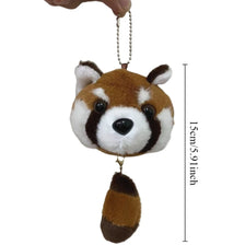 A plush toy of a red panda with brown and white fur, hanging from a chain.