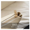 Close-up of a light beige straw woven tote bag showing exquisite gold hardware and PU trim detail.