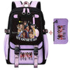 A purple and black canvas backpack featuring a funny print design with pink accents.