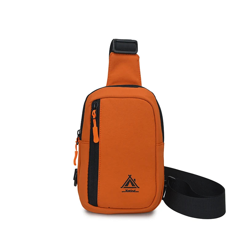 An orange nylon sling crossbody bag with a black strap and adjustable buckle.
