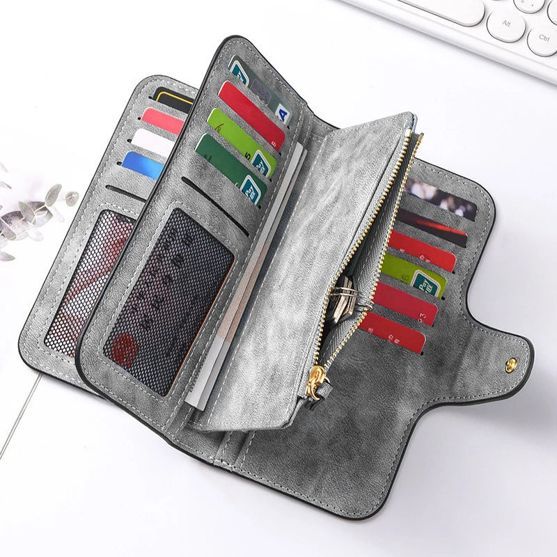 A gray leather long zipper handbag coin purse with multiple card slots and a mesh pocket.