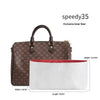 A brown patterned leather handbag with a black strap and a white inner lining.
