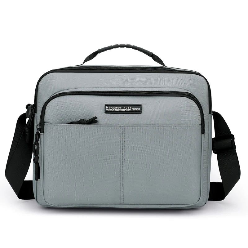 A gray professional waterproof men's business briefcase with black straps and a leather tag.