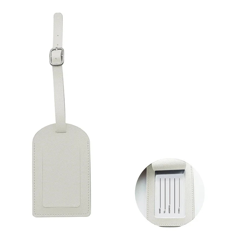 A rectangular, light beige PU leather luggage tag with a strap for attaching to a bag.
