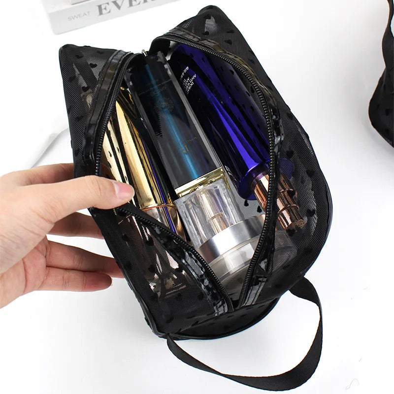 A black mesh storage bag is open, revealing several glass makeup bottles inside.