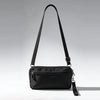 Black premium zipper phone pouch with a black wrist strap shown against a light gray background.