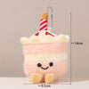 A fluffy pink bread shaped plush keychain with a striped white and red frosting top.