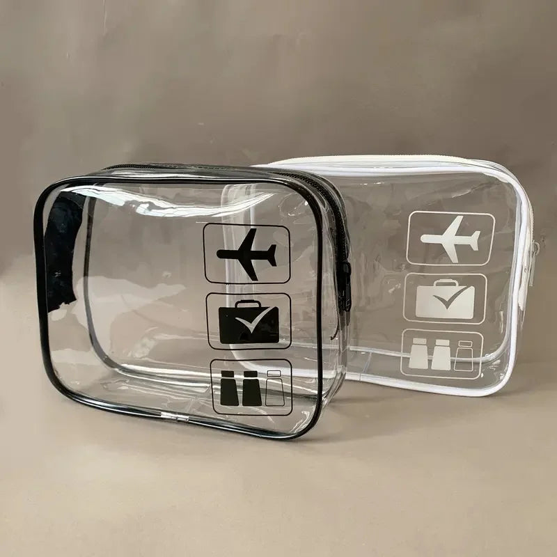 A clear plastic toiletry bag with icons for a plane, suitcase, and toiletries.