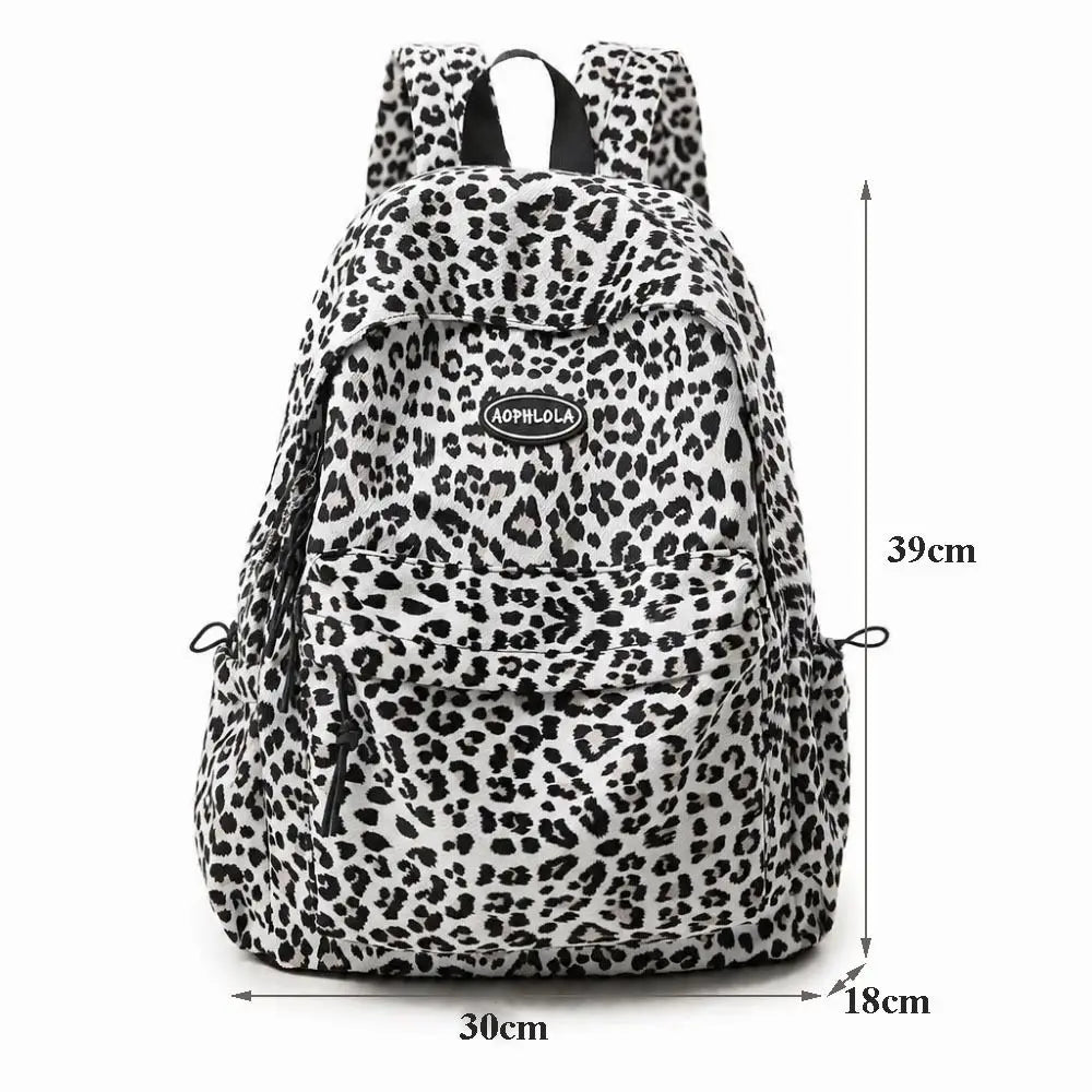 A leopard print laptop backpack with padded straps shown from the front.