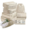A set of beige mesh packing cubes and a drawstring bag for travel organization.