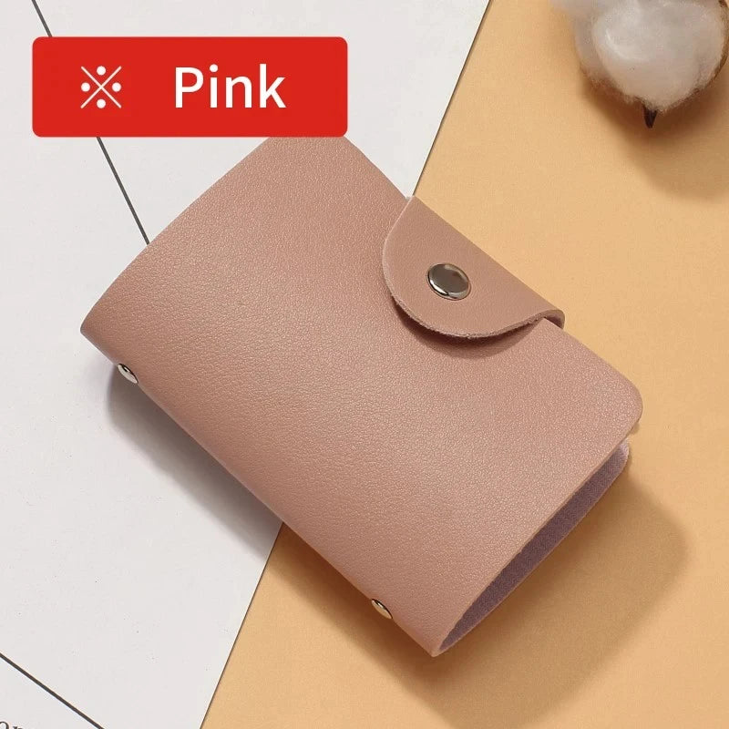 A pink premium PU leather ID and credit card wallet shown in a close-up view.