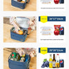 A blue insulated portable lunch bag with a shoulder strap is shown open, containing various food items.