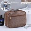 A brown portable PU leather cosmetic organizer bag is shown next to a white sink and grooming tools.