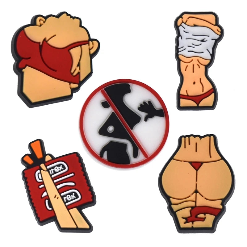 A collection of decorative shoe charms and pins featuring various designs like a face, a hand, and a shoe print.
