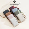 A collection of women's Baellerry zip-around wallets in various colors and textures arranged on a light background.