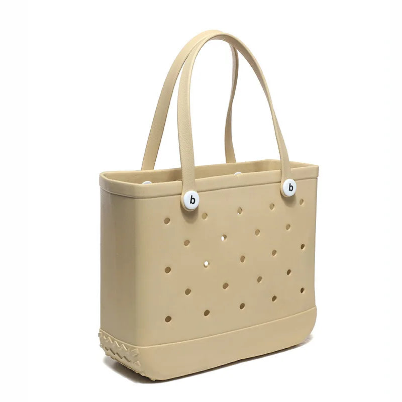 A beige portable EVA beach tote bag with a perforated design and light brown handles.