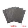 A stack of ten gray polishing cloths measuring 6x8cm for silver and gold jewelry