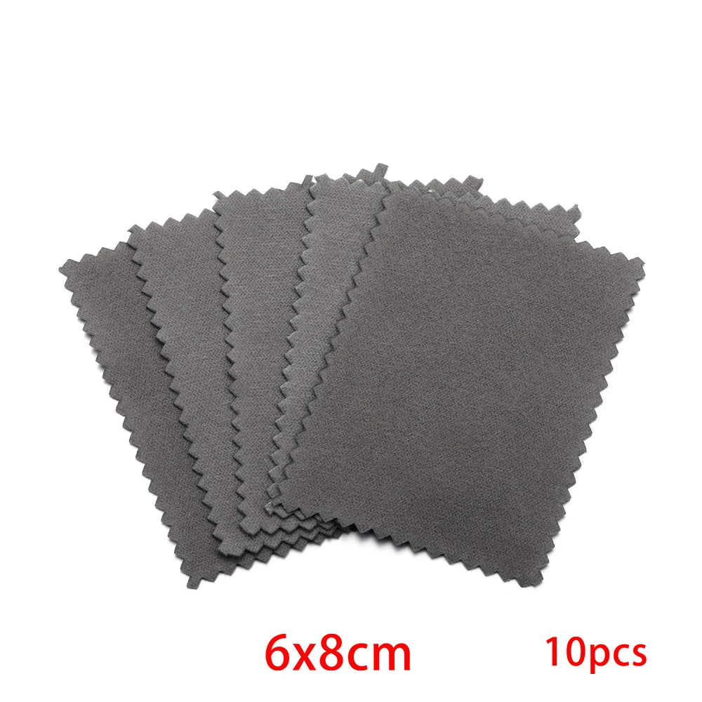 A stack of ten gray polishing cloths measuring 6x8cm for silver and gold jewelry