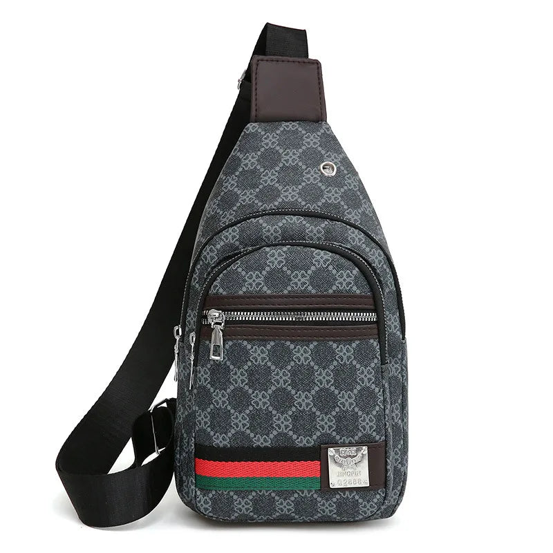 A dark gray patterned printed crossbody sling bag with a brown strap and zipper detail.