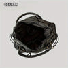 A black vintage washed leather tote bag with a handle shown from the interior.