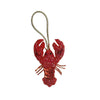 Hand sewn rhinestone beaded bag charm shaped like a red lobster