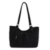 Black retro polka dot shoulder tote bag with a black strap