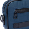 A close-up view of a navy blue PU leather crossbody bag with a zipper and adjustable strap.