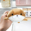 A hand holds an orange otter plush toy designed as a pencil case.
