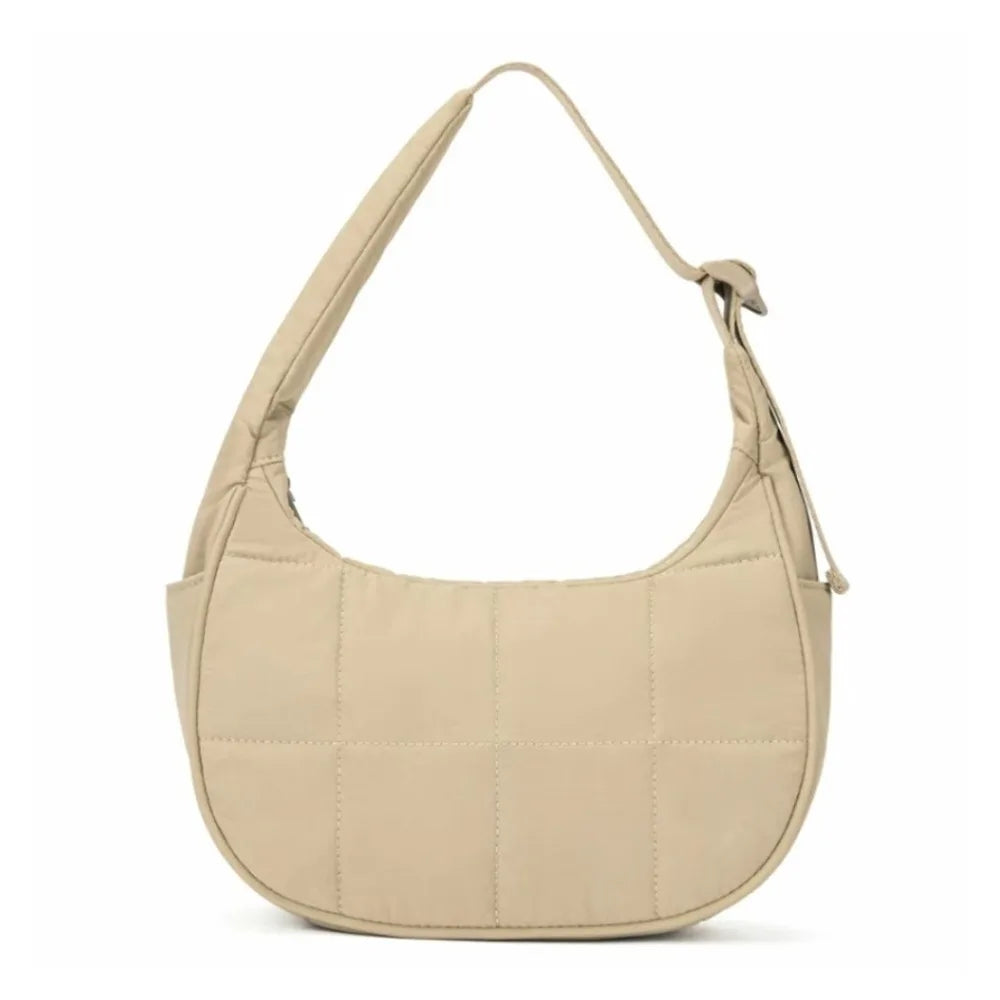 A beige quilted nylon shoulder bag with an adjustable strap.
