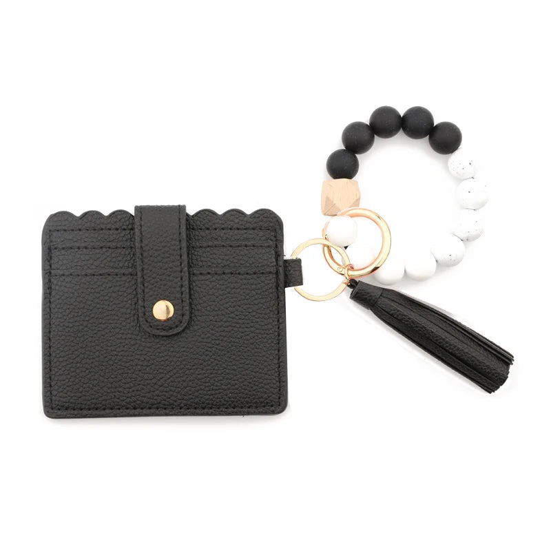 Black leather card holder and silicone bead bracelet with gold accents
