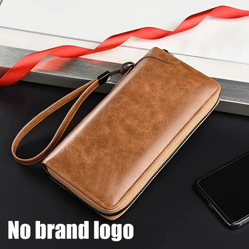 A brown PU leather zipper wallet with a leather strap is shown on a dark surface next to a smartphone.