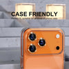An orange iPhone is shown with a glitter diamond camera lens protector and metal frame installed.