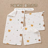 White muslin baby burp cloth towels in various sizes, including a long piece and a smaller square.
