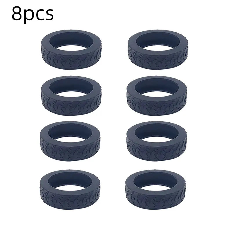 A set of eight dark blue silicone luggage wheel protection rings.