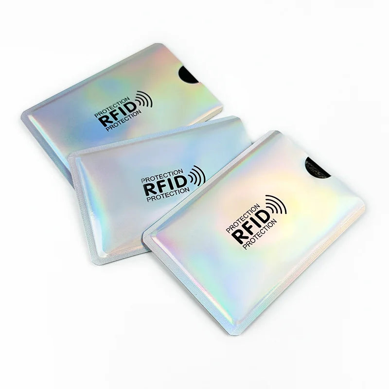 Three transparent plastic card sleeves with RFID protection markings are displayed on a white background.
