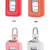 A set of leather car key cases in red, orange, pink, and white with transparent windows and silver clasps.
