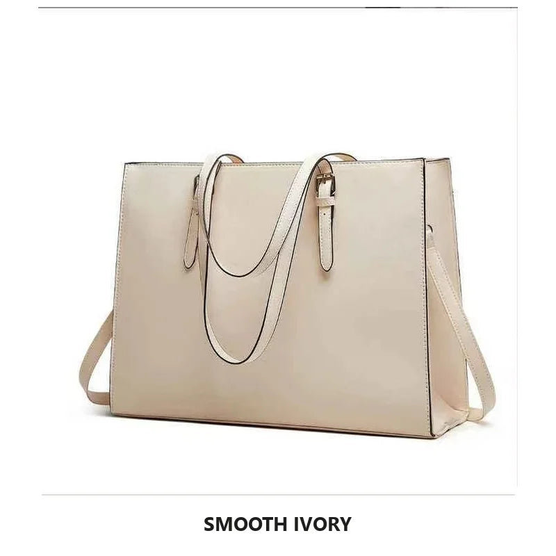 A beige large capacity laptop tote bag with a crocodile texture shown against a white background.