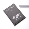 A gray leather passport wallet with a world map design and a small airplane icon.