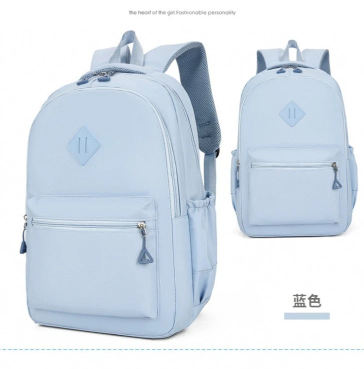 Light blue durable nylon commuter backpack shown from the front and side view.
