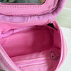 A pink striped Y2K makeup bag with a zipper is shown open, revealing a pink cotton toiletry pouch inside.